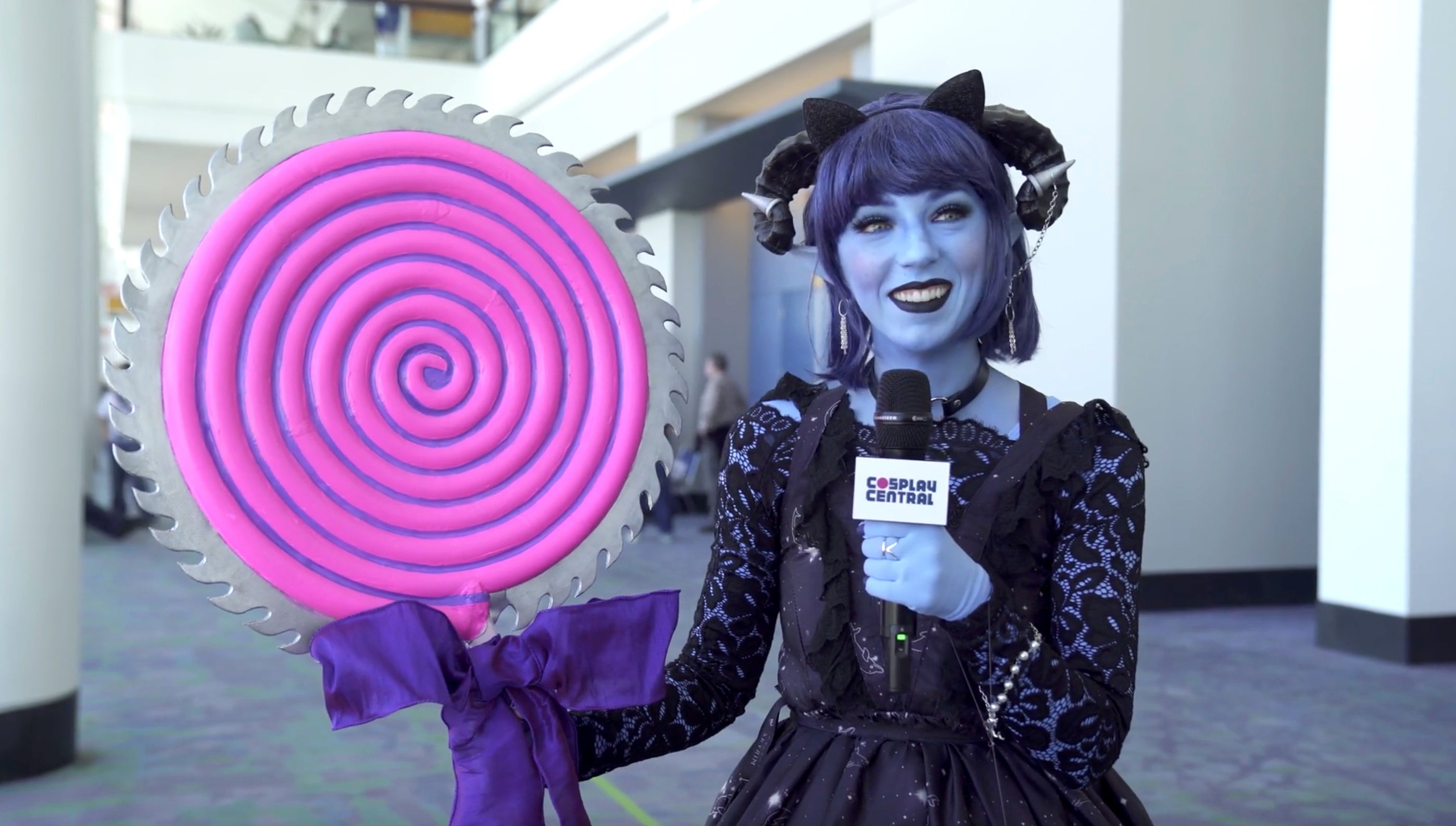 April cosplaying as Jester from Critical Role.