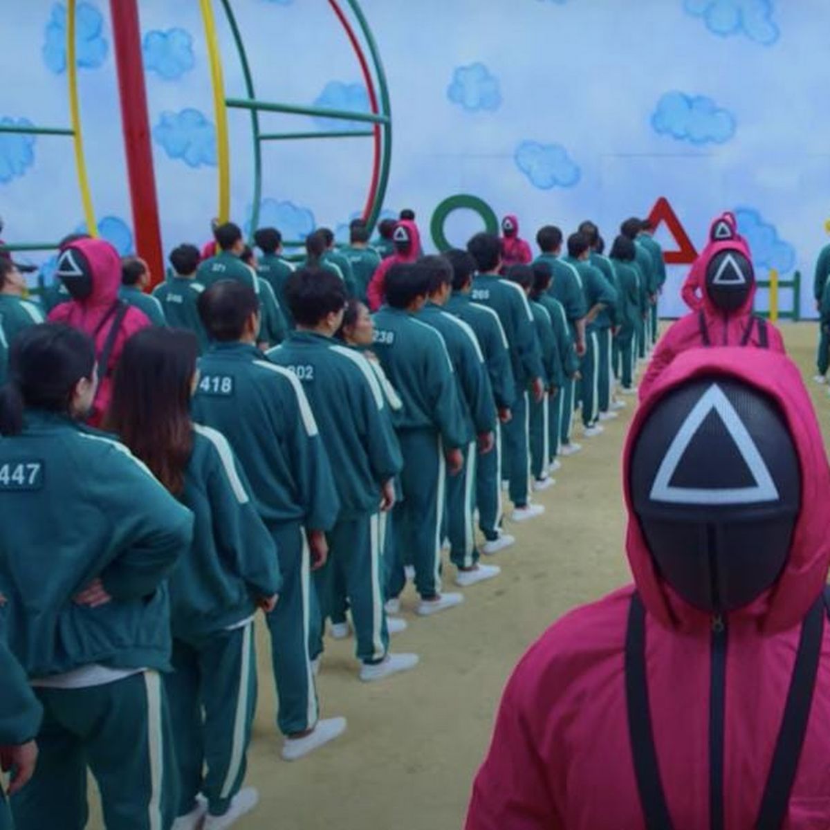 Squid Game contestants and guards in the playground room